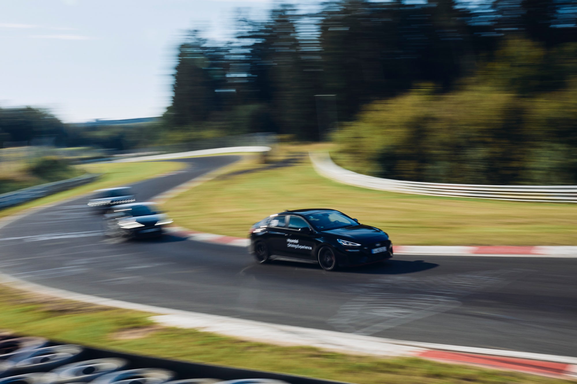 Hyundai cars on race track at a track day