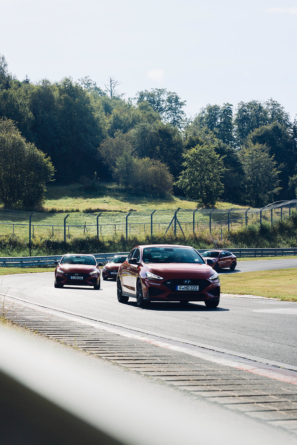 Hyundai cars driving on a racetrack