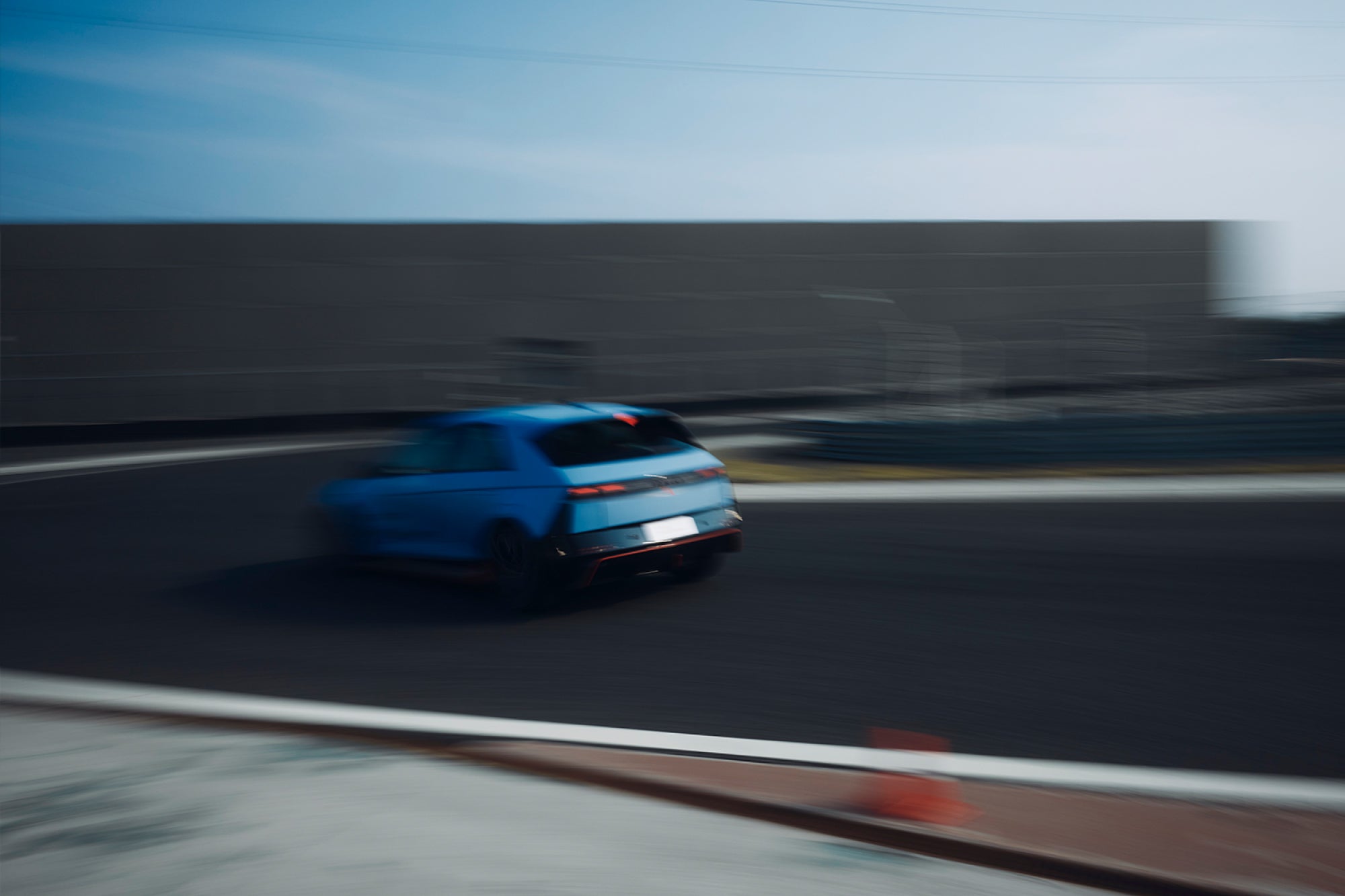 Hyundai IONIQ 5 N approaching a corner on a racetrack
