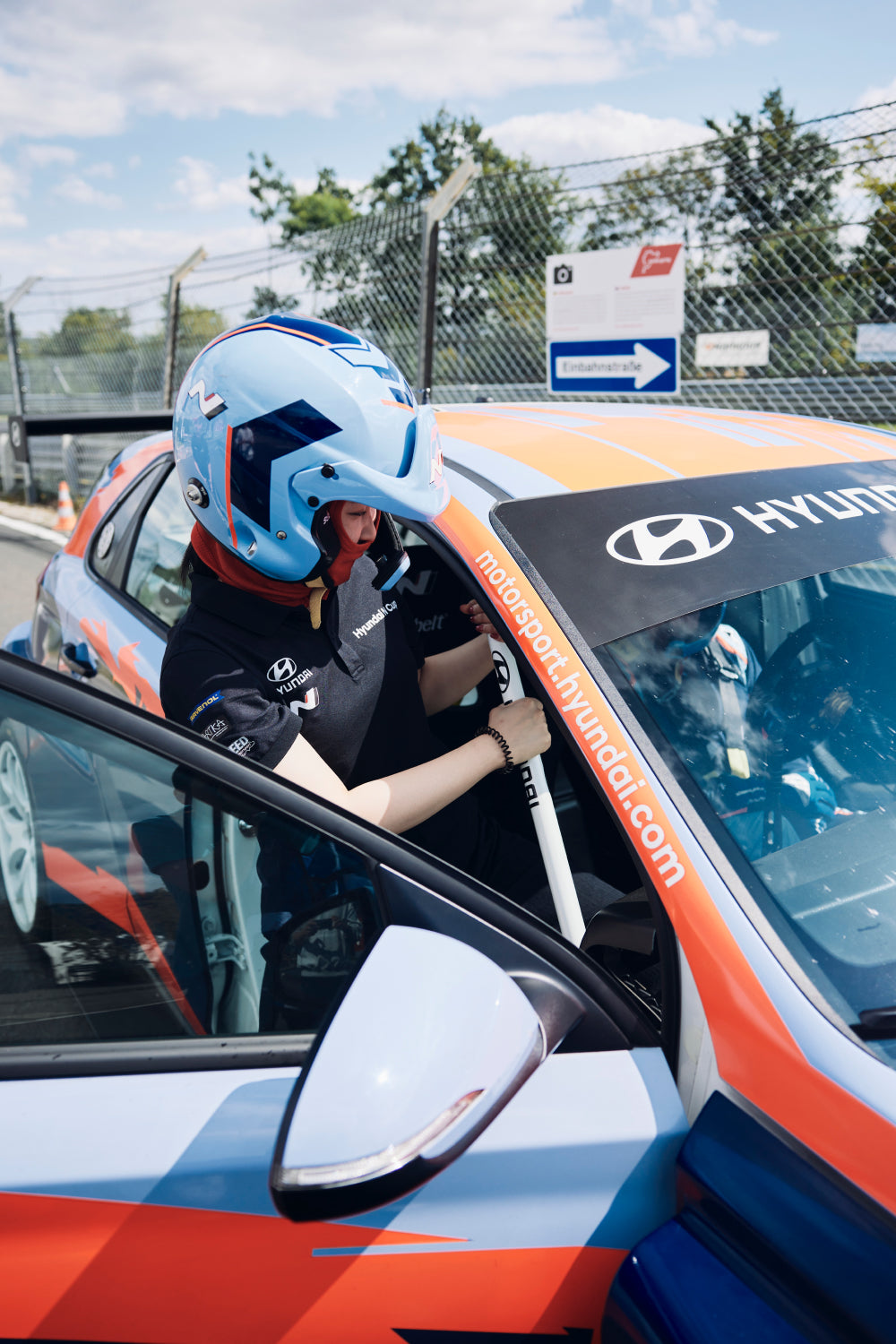 passenger entering the Hyundai N Taxi TCR
