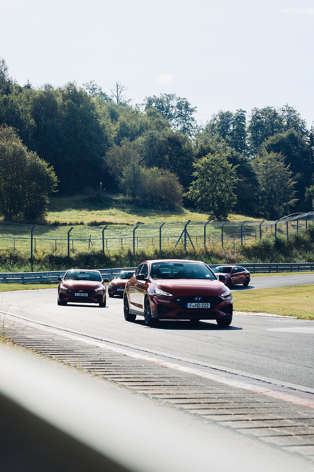 Hyundai cars driving on a racetrack
