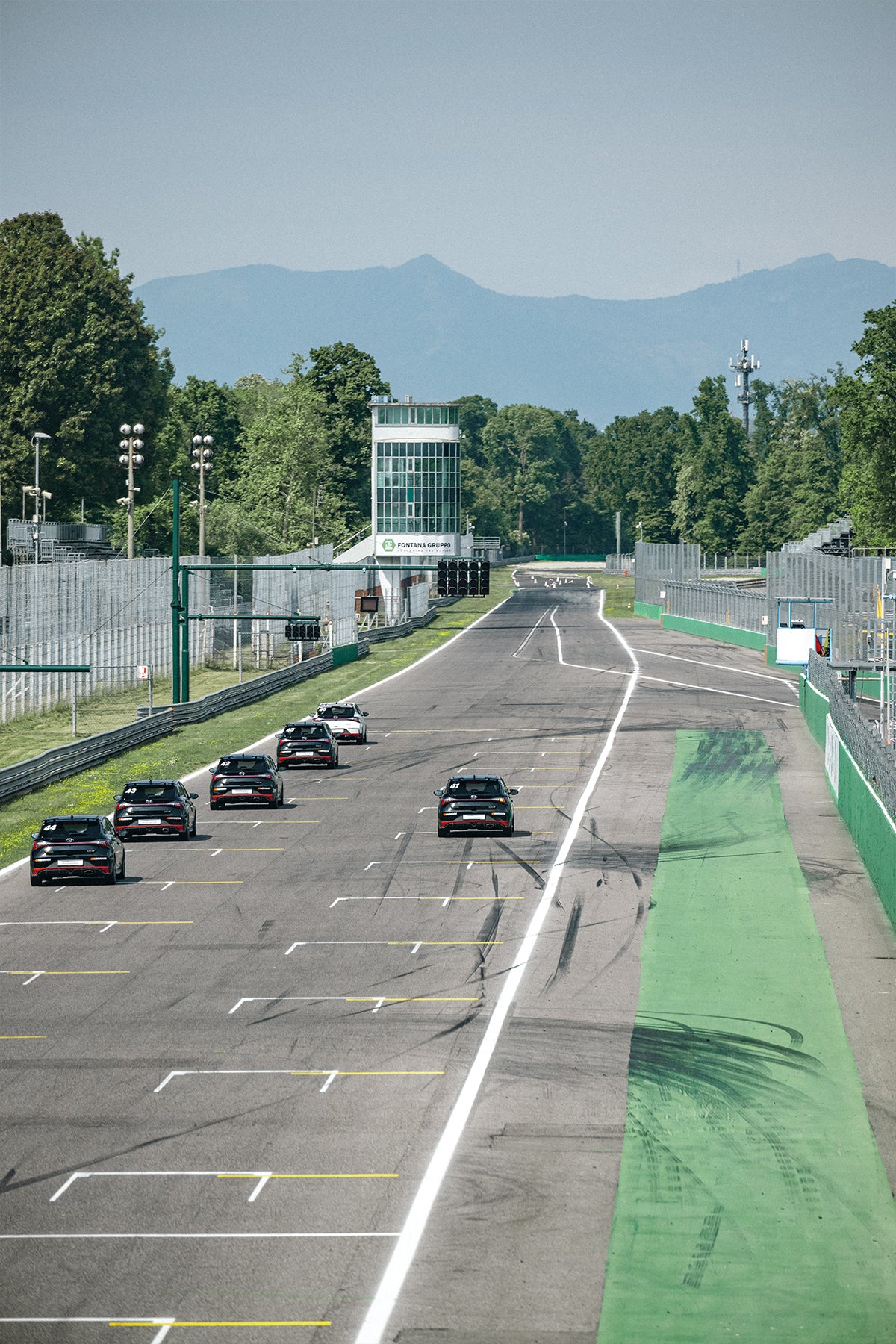 Hyundai cars on the starting grid of a racetrack
