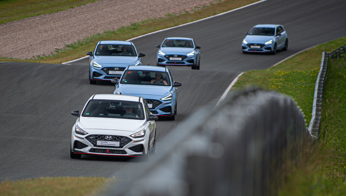 Hyundai i30 N training vehicles doing pace car laps on the racetrack