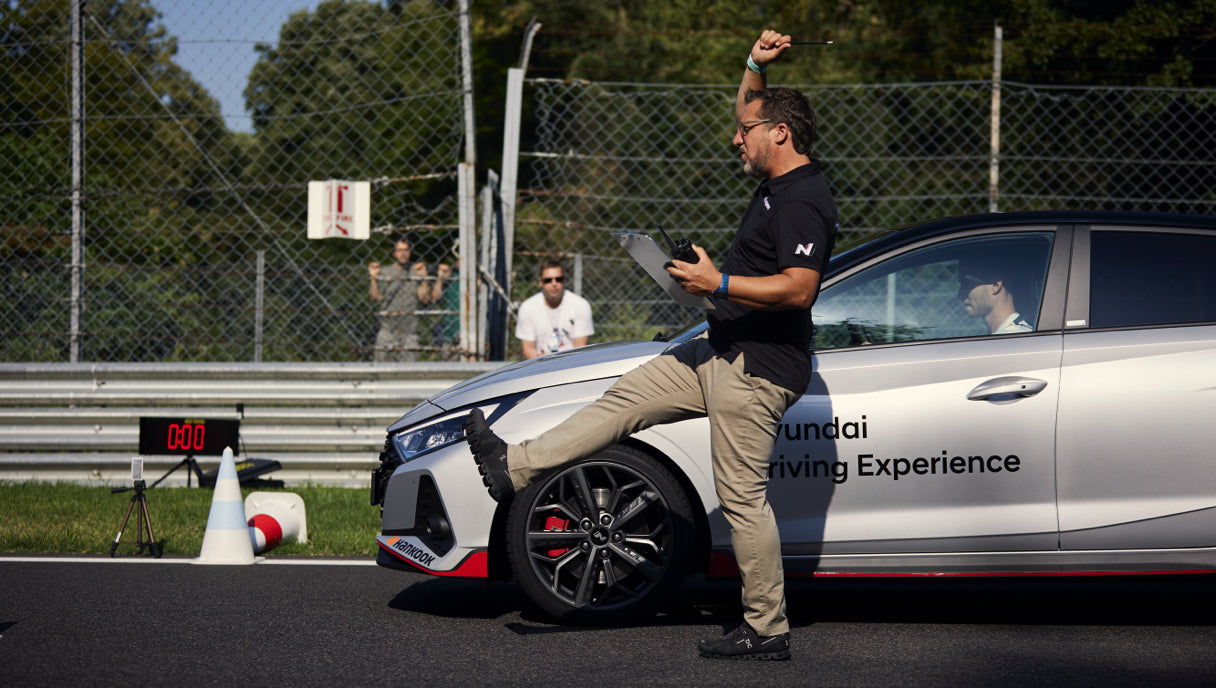 Hyundai Driving Experience instructor giving guidance to participant